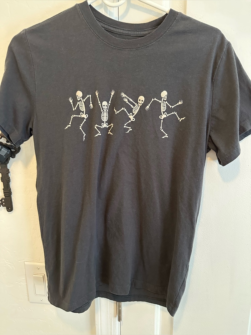 Ladies/Unisex dark grey tee shirt with skeletons in poses size XSmall
